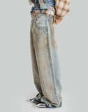MUD-DYED DISTRESSED JEANS