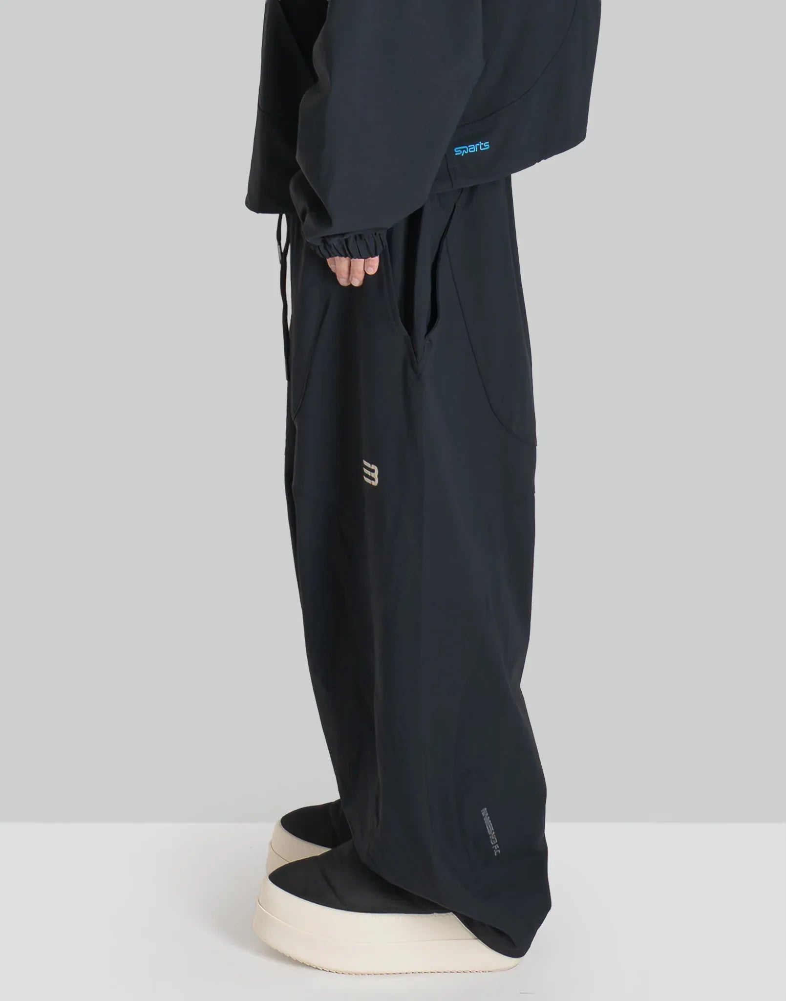 NOMAD TRACK PANTS