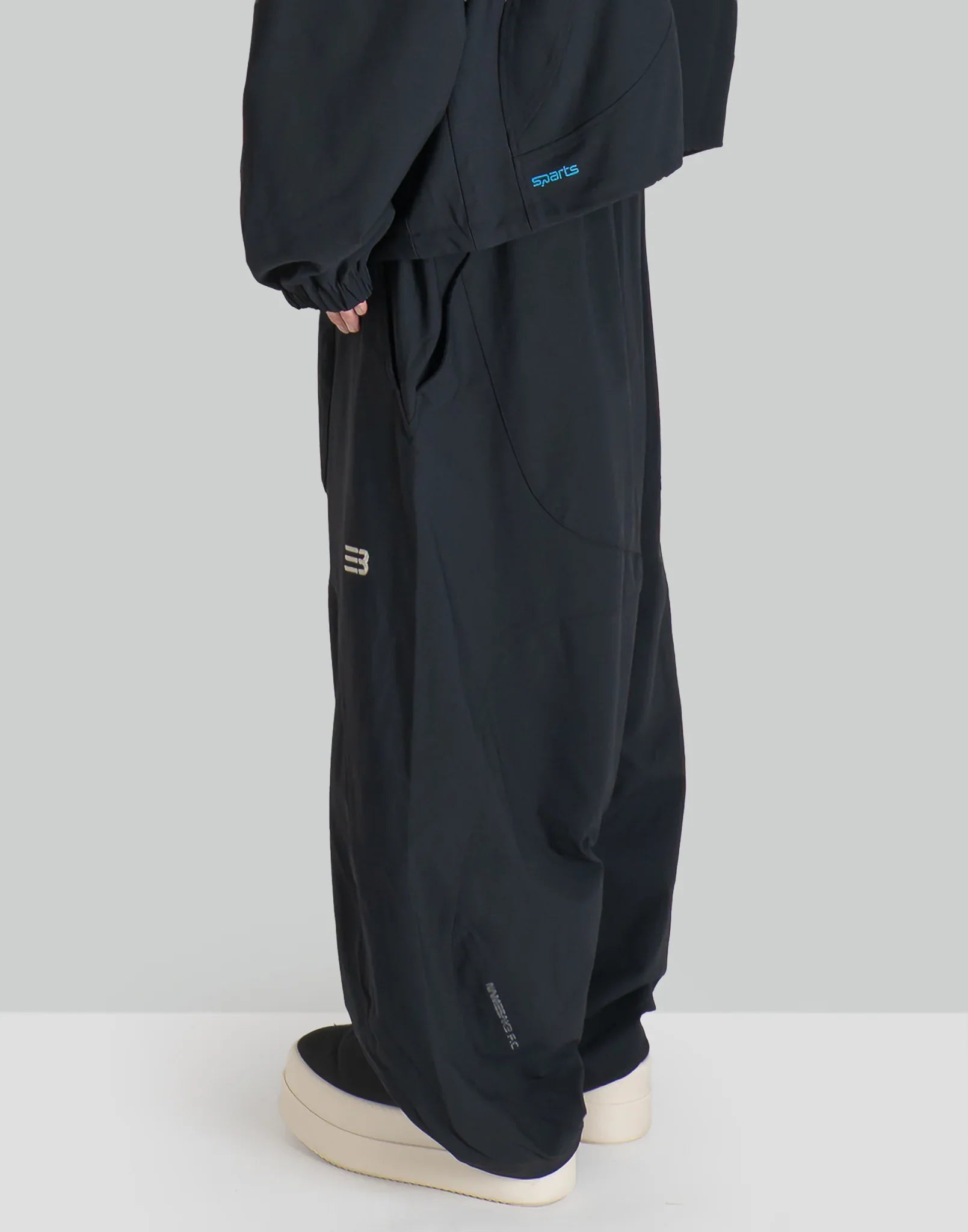 NOMAD TRACK PANTS