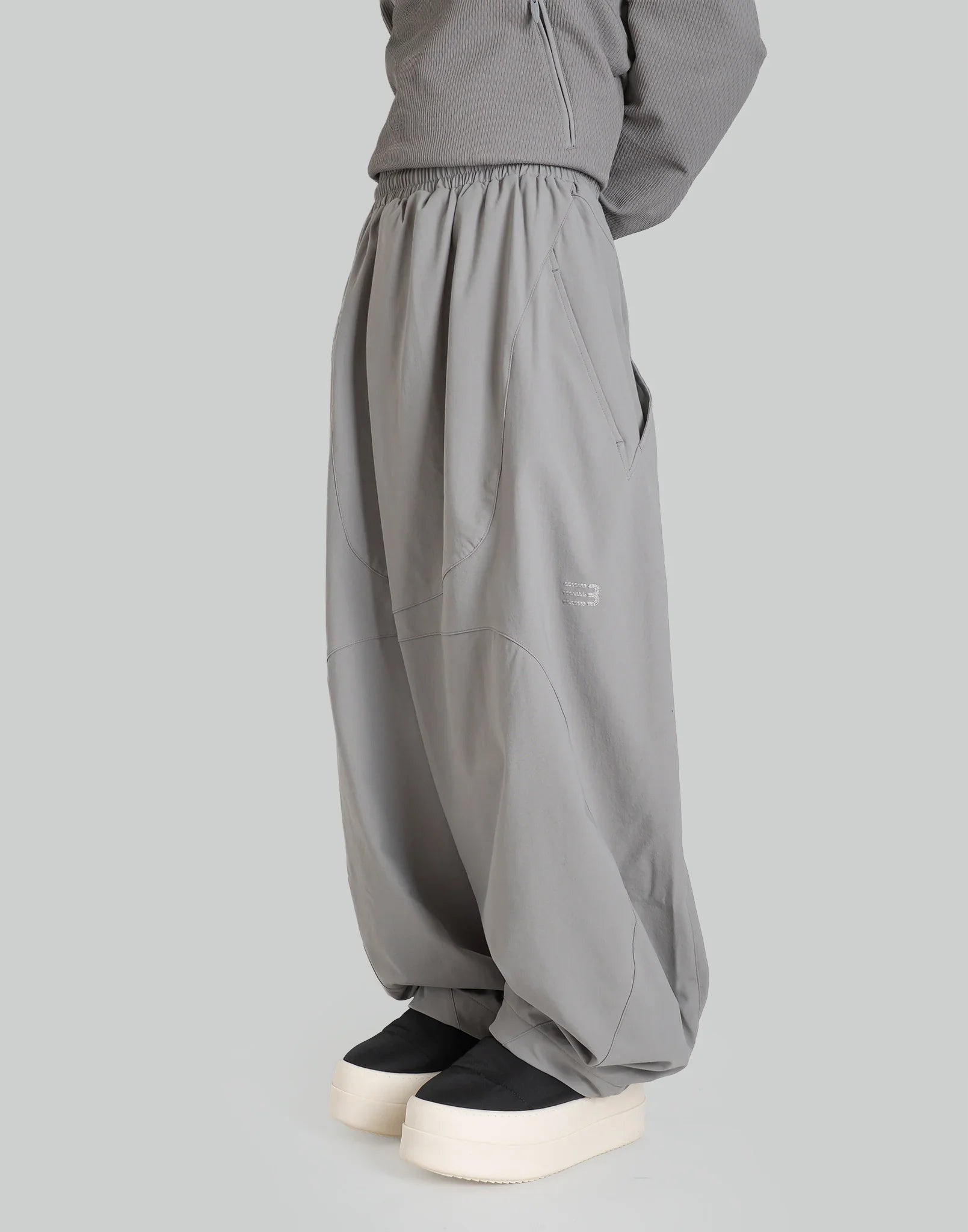 NOMAD TRACK PANTS