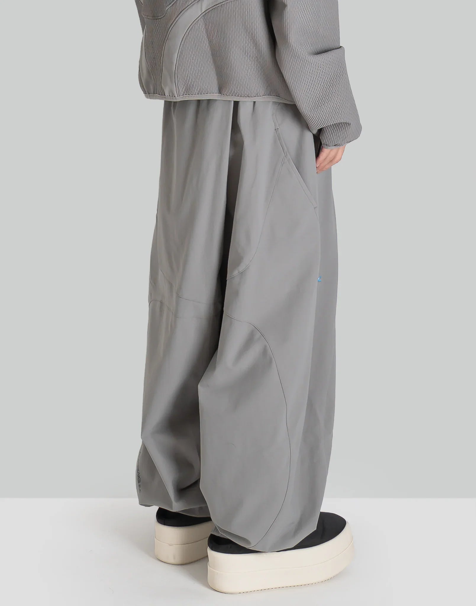 NOMAD TRACK PANTS