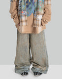 MUD-DYED DISTRESSED JEANS