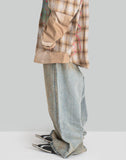 MUD-DYED DISTRESSED JEANS