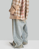 MUD-DYED DISTRESSED JEANS
