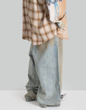 MUD-DYED DISTRESSED JEANS