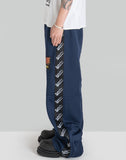 STACKED TRACK PANTS